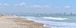 albufera-pebble-beach-and-cityscape thumb